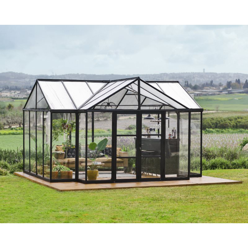 chalet-greenhouse-triomphe-palram-sitting-in-empty-field