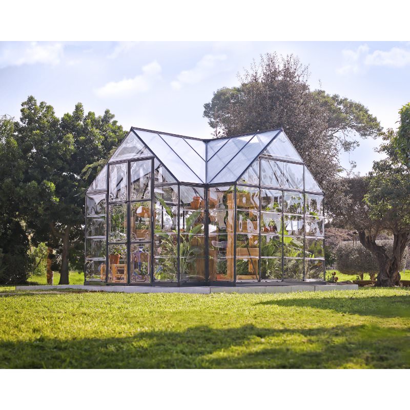 chalet-greenhouse-with-bookshelves-and-lots-of-plants-inside