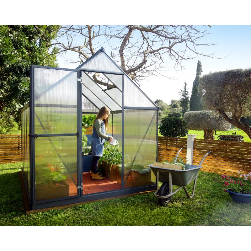 mythos-greenhouse-girl-tending-to-plants-inside