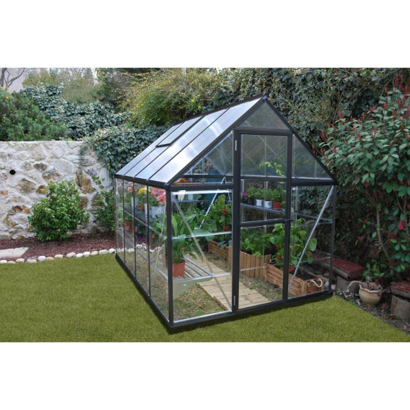 palram-canopia-hybrid-6x8-gray-at-edge-of-a-garden