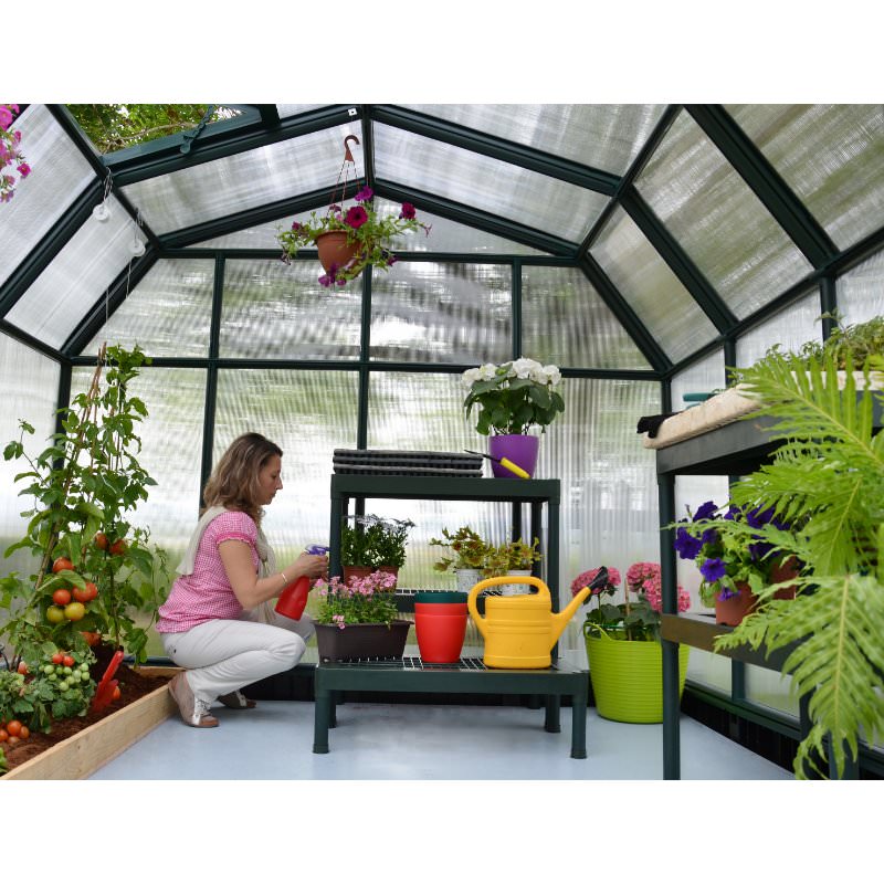 palram-hobby-greenhouse-woman-tending-to-plants