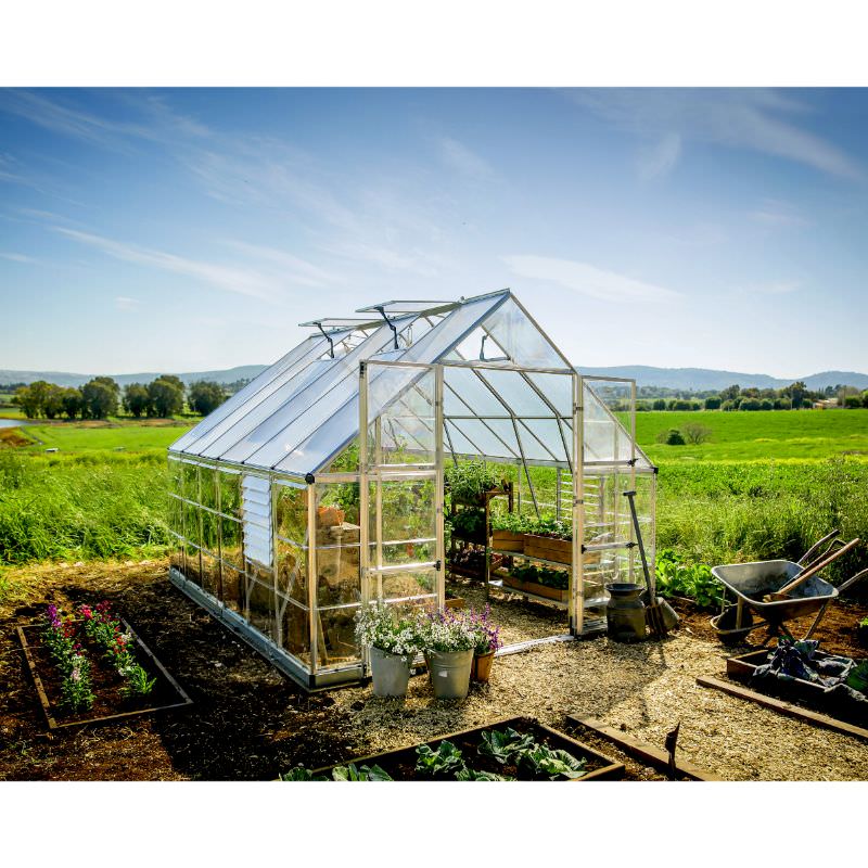 palram balance greenhouse silver right front view on a farm