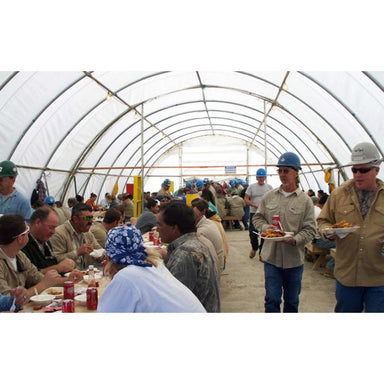 rhino shelter construction tent workers walking with food